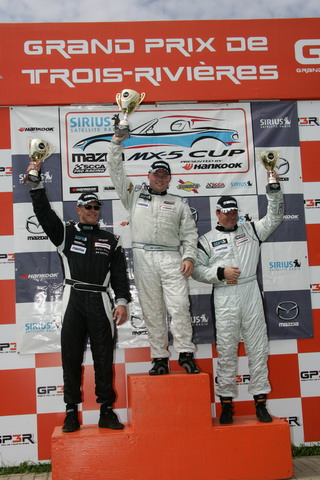 (l-r) Anders Hainer, Jim Daniels and Todd Buras celebrate on the podium. 